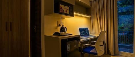 Laptop workspace, blackout drapes, soundproofing, iron/ironing board