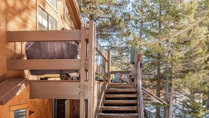 A wooden cabin with a wooden staircase leading to a deck. - West Village-Large Lovely Private Home in Kirkwood (Kirkwood)
