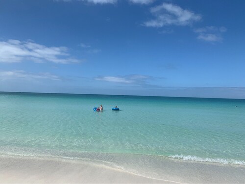 Gulf Beach Retreat, just steps from the sand of Anna Maria!  Private heated pool