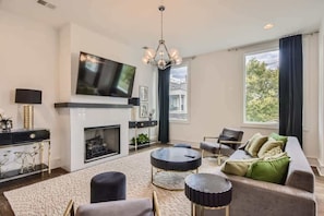 TV, fireplace, offices - Luxury Gulch Condo w/ Private Rooftop Deck (Nashville)