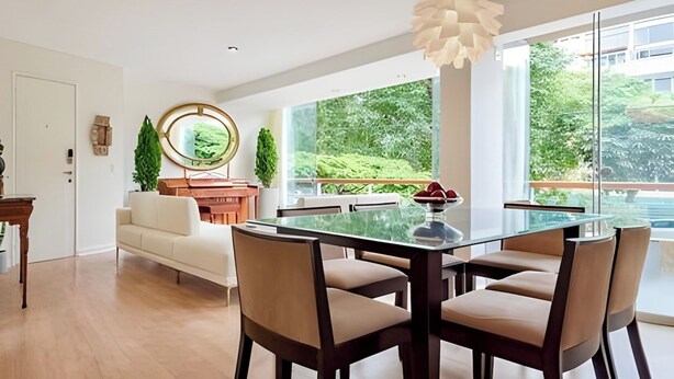 A modern dining area with a glass table and chairs, a piano, a sofa, and a large window with a view of greenery. - ✶ Kotosh Residence ✶ LUXURY Best Location | Piano (Miraflores)