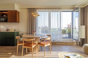 Penthouse, 3 Bedrooms, City View | Living area | 55-inch flat-screen TV with cable channels