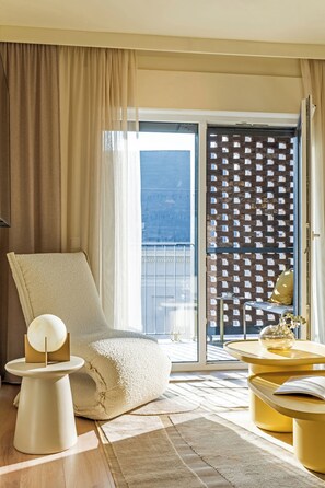 Apartment, 2 Bedrooms | Living area | 55-inch flat-screen TV with cable channels