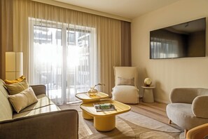 Apartment, 2 Bedrooms | Living area | 55-inch flat-screen TV with cable channels