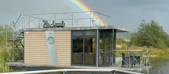 Boat house on a peaceful lake in Scotland