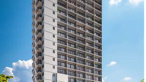 Un immeuble de grande hauteur doté de nombreux balcons, un espace commercial situé au rez-de-chaussée et un ciel dégagé.