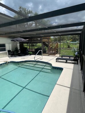 Outdoor pool - Lovely LakeFront 3 bed 2 Bath Lake house w/ Games Kayaks Pool in New Port Richey (New Port Richey)
