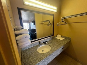 Bathtub, hair dryer, towels, soap