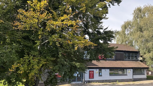 A two-story building with a sign indicating it is a pub. - Comfortable Room in a shared apartment. (Cardiff)
