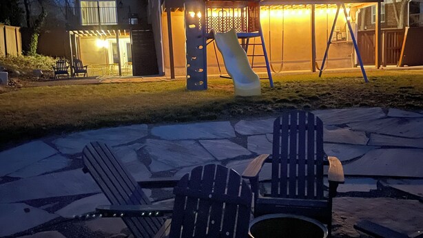 A house with a patio area featuring Adirondack chairs and a fire pit. - Extended Ski/Work/Visit secluded Cul-da-sac cutie (Salt Lake City)