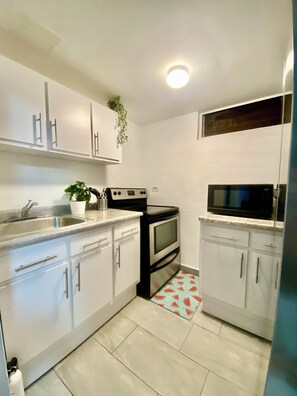 Fridge, microwave, stovetop, coffee/tea maker