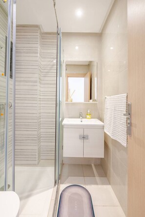 Shower, hair dryer, towels, soap