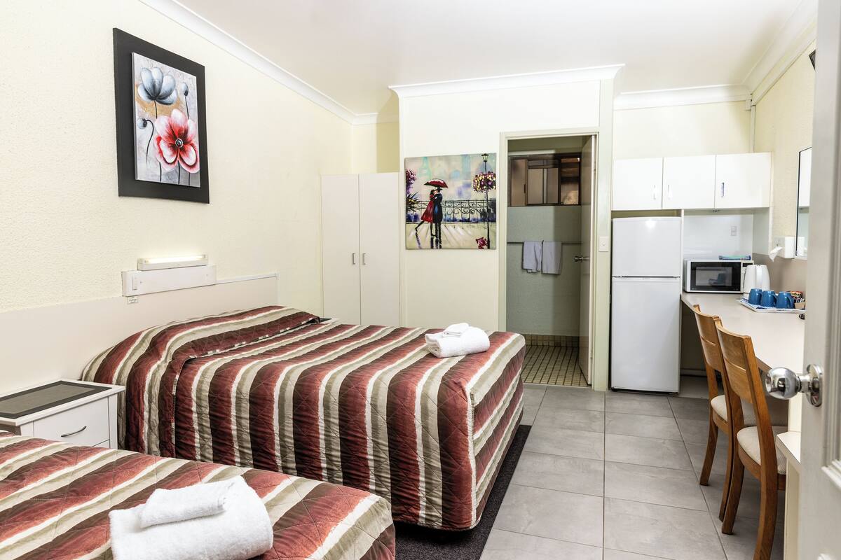 Desk, laptop workspace, blackout curtains, iron/ironing board