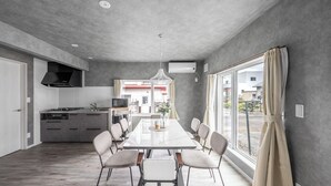 A modern kitchen with a dining area. - SASAMEYUKI (Furano)