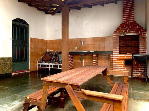 Large house with barbecue and garage.