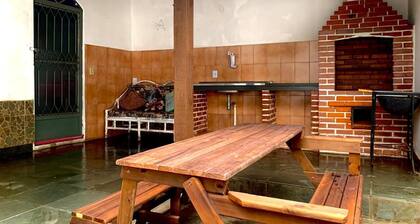 Large house with barbecue and garage.