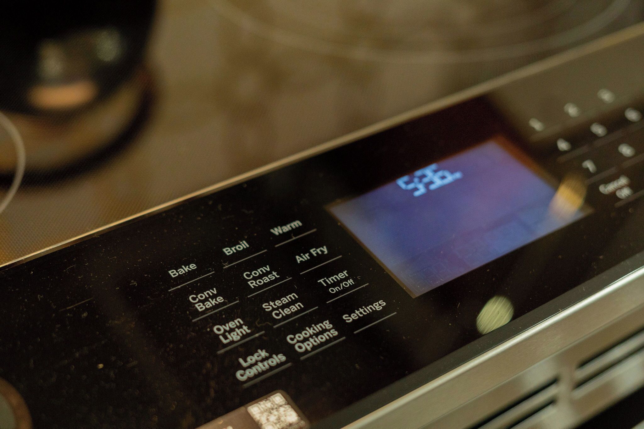 A digital oven control panel with various cooking settings.