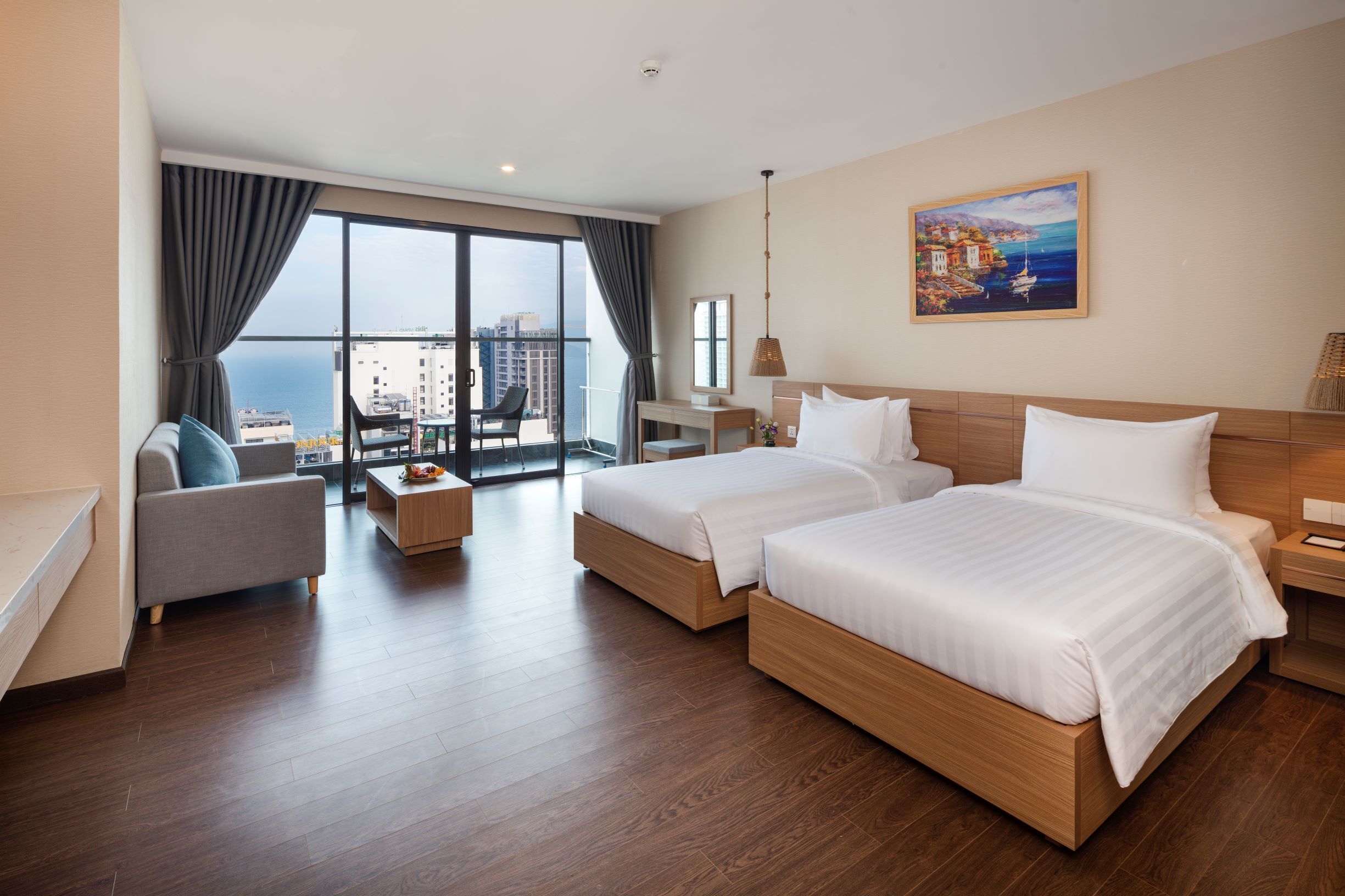 Deluxe Room, Balcony, Sea View | Minibar, in-room safe, desk, laptop workspace