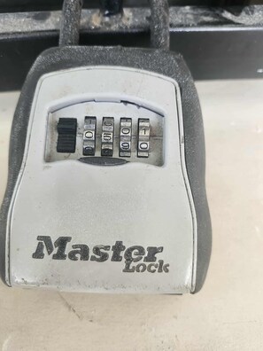 A Master Lock padlock. - A tropical beach is a three-minute walk away (Playas Del Coco)