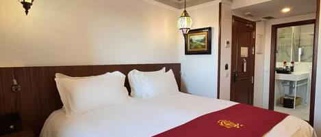 Egyptian cotton sheets, premium bedding, down comforters, free minibar