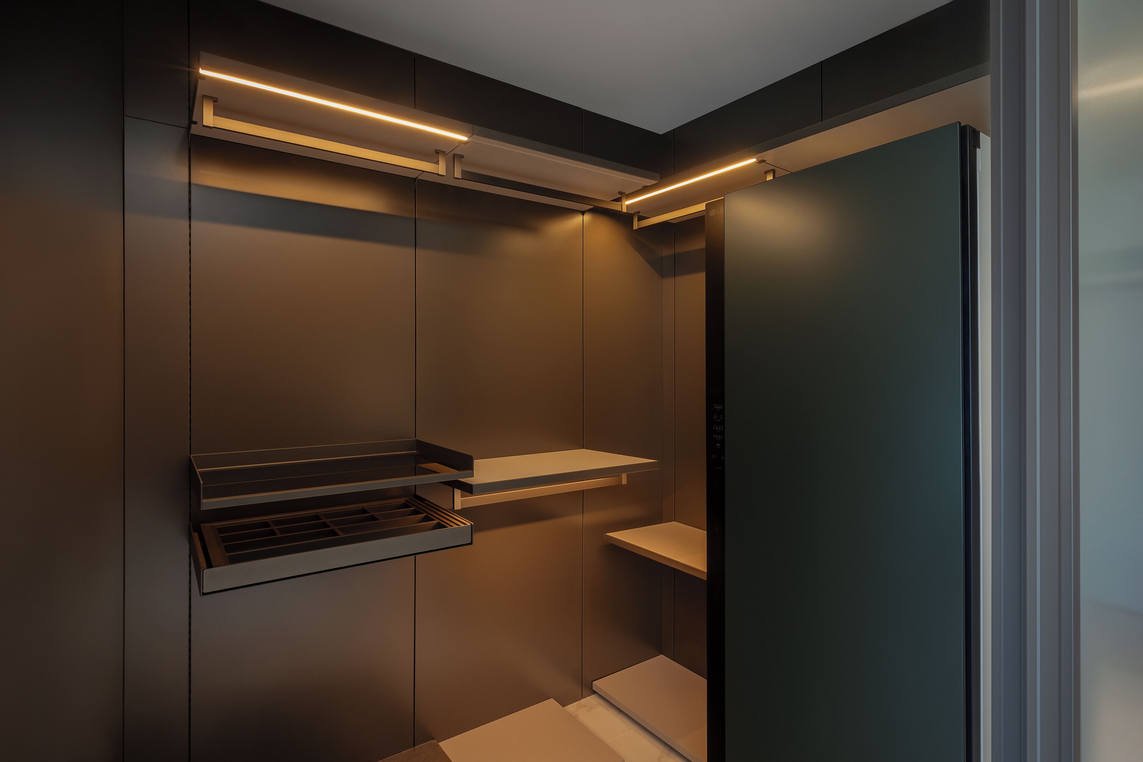 A modern elevator with a minimalist design, featuring a sleek control panel and illuminated edges.