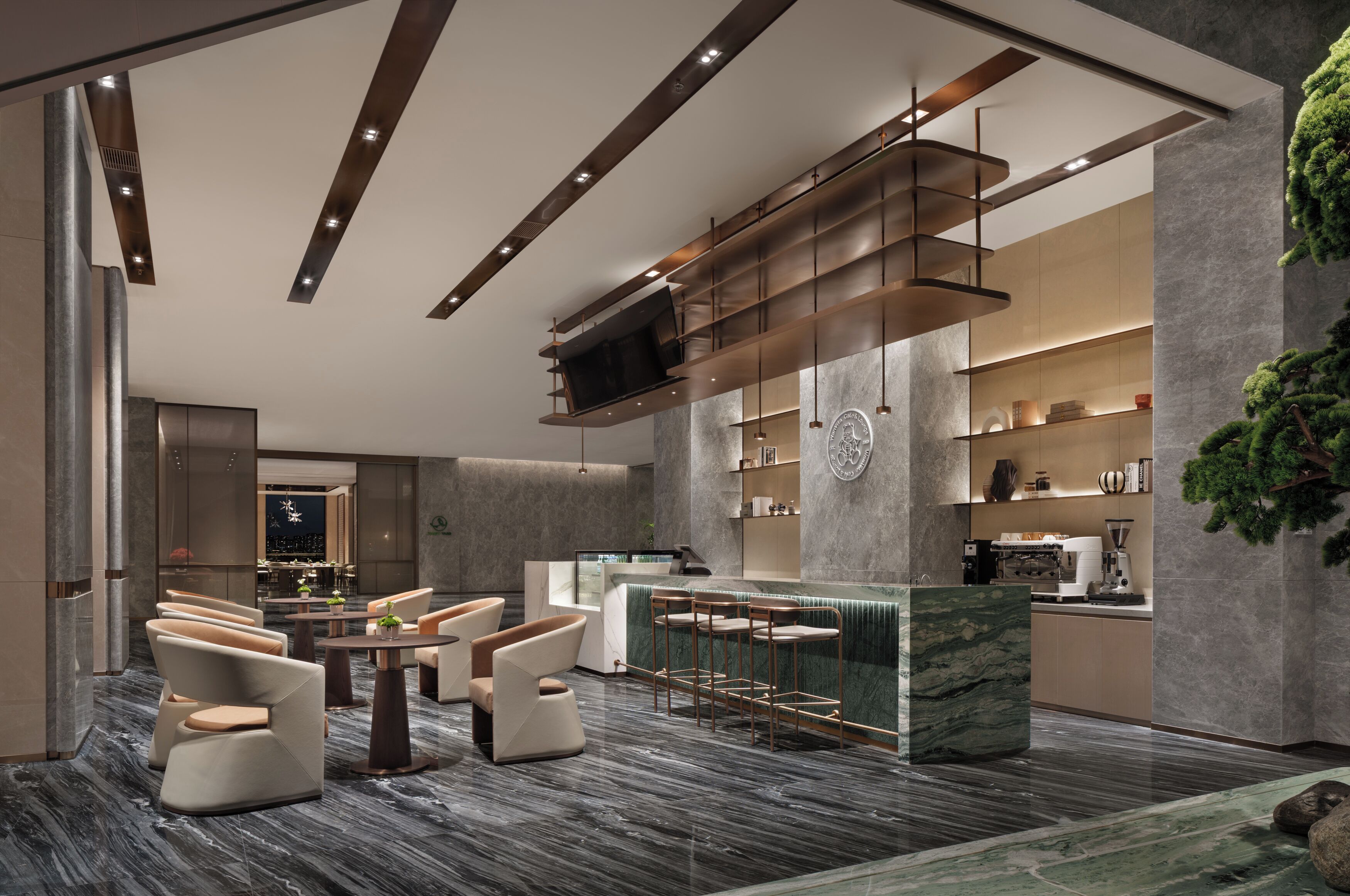 A modern interior with a bar area, seating, and a kitchen.