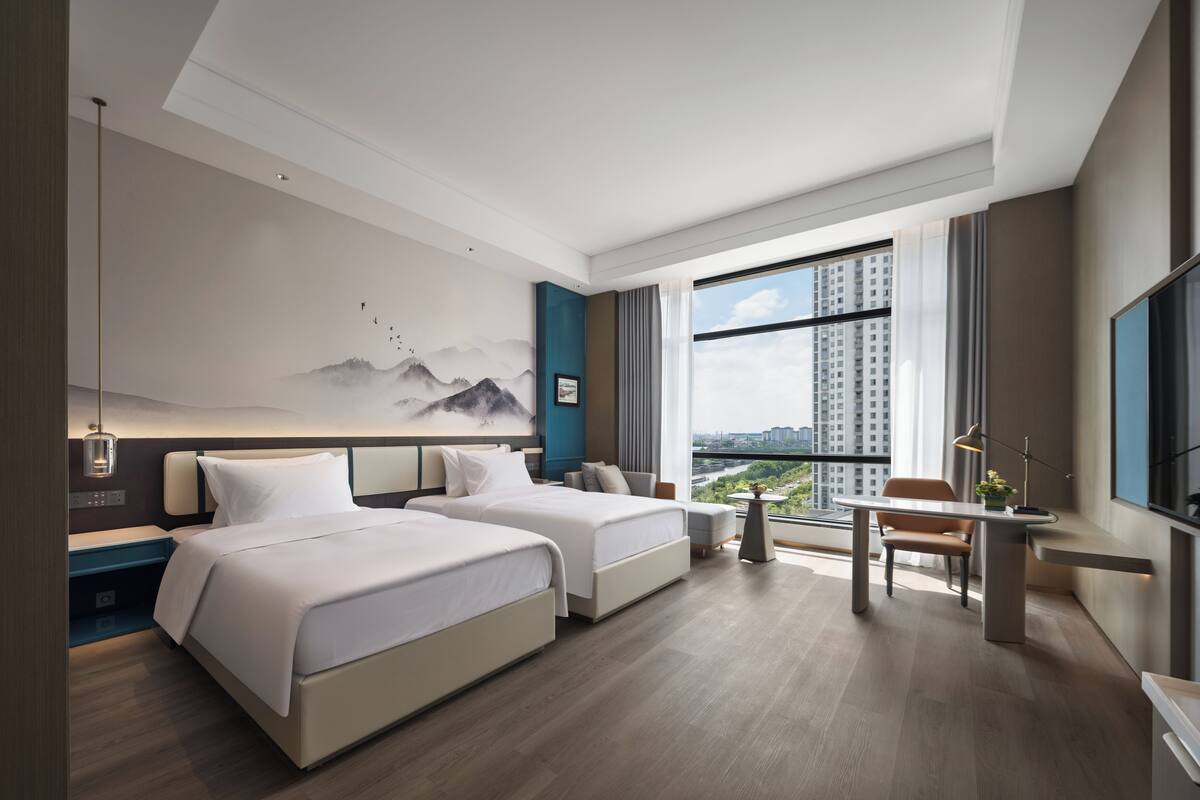 Desk, laptop workspace, blackout drapes, iron/ironing board