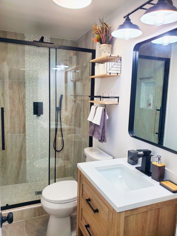 Shower, towels, soap, toilet paper