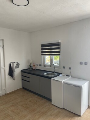Fridge, coffee/tea maker, cookware/dishes/utensils