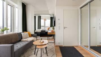 Deluxe Condo, 1 Queen Bed with Sofa bed, Kitchen, City View | Living area | 55-inch flat-screen TV with cable channels