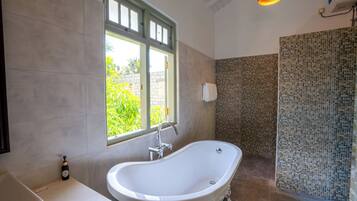 Superior Suite, Balcony, Pool View | Bathroom | Bathrobes, towels, soap, shampoo