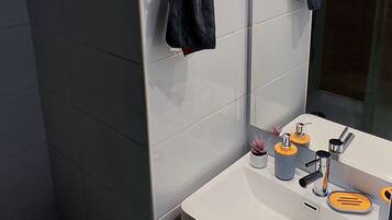 Shower, towels, soap, toilet paper