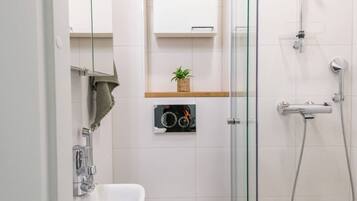 Apartment, City View | Bathroom | Shower, hair dryer, towels, soap