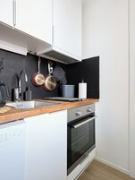 Apartment, City View | Private kitchen | Full-size fridge, microwave, oven, stovetop