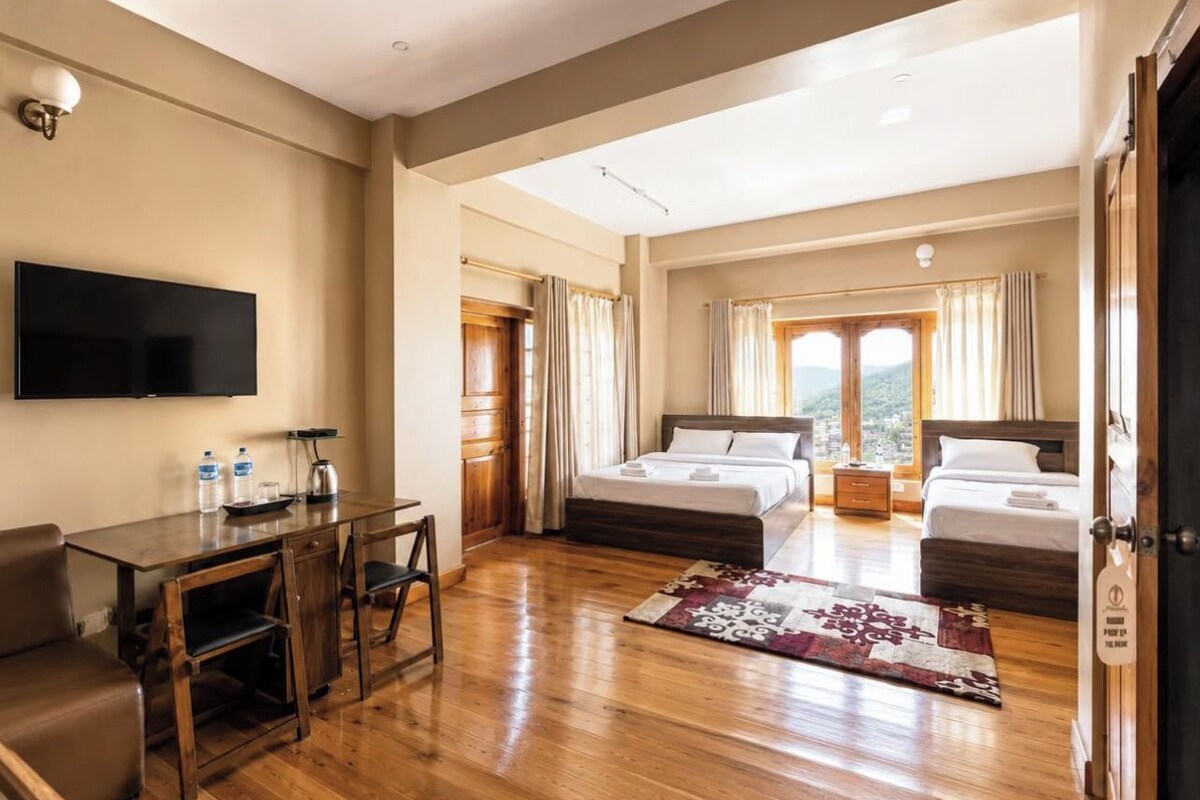 Family Studio Suite, 2 Queen Beds, City View | Laptop workspace, individually furnished, bed sheets