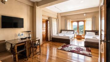 Family Studio Suite, 2 Queen Beds, City View | Laptop workspace, individually furnished, bed sheets