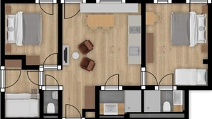Un plan d’aménagement de chambre d’hôtel comprenant un lit, un coin salon et une salle de bain.