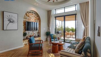 Deluxe Villa, 3 Bedrooms, Pool View | Living area | 65-inch LED TV with cable channels, streaming services