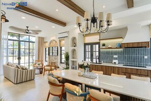 Deluxe Villa, 4 Bedrooms | Shared kitchen | Full-size fridge, microwave, stovetop, rice cooker - Life Travel Villa - Novaworld Phan Thiet (Phan Thiet)