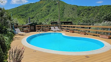 Seasonal outdoor pool, pool umbrellas, pool loungers