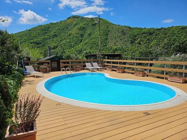 Seasonal outdoor pool, pool umbrellas, sun loungers