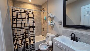 Shower, towels, soap, toilet paper