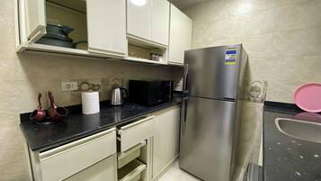 Premium Apartment, Balcony, City View | Private kitchen | Full-sized fridge, microwave, oven, stovetop