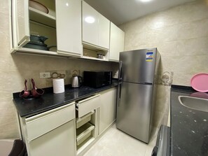 Căn hộ Premium, ban công, quang cảnh thành phố | Bếp riêng | Tủ lạnh, lò vi sóng, lò nướng, bếp nấu 