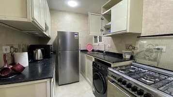 Premium Apartment, Balcony, City View | Private kitchen | Full-sized fridge, microwave, oven, stovetop
