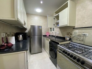 Căn hộ Premium, ban công, quang cảnh thành phố | Bếp riêng | Tủ lạnh, lò vi sóng, lò nướng, bếp nấu 