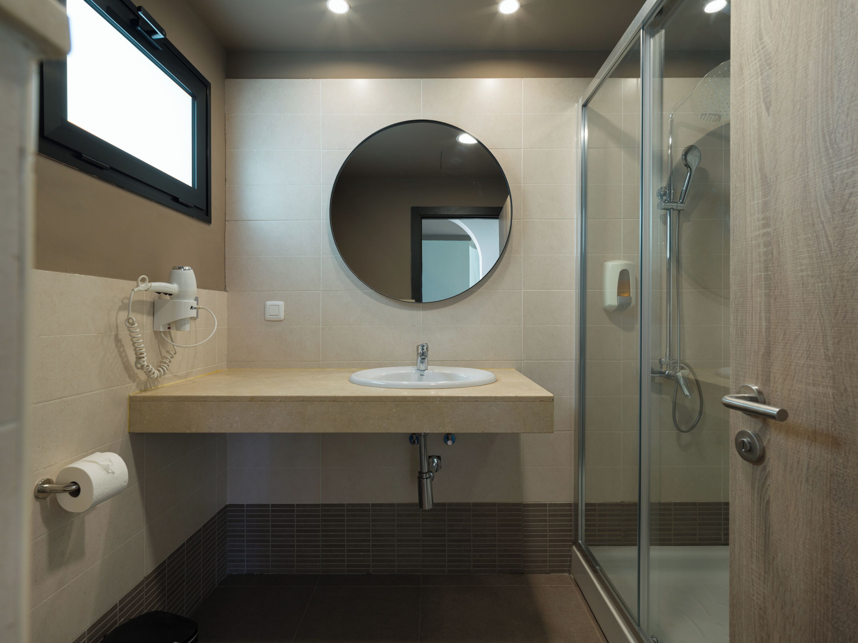 Shower, hair dryer, towels, toilet paper