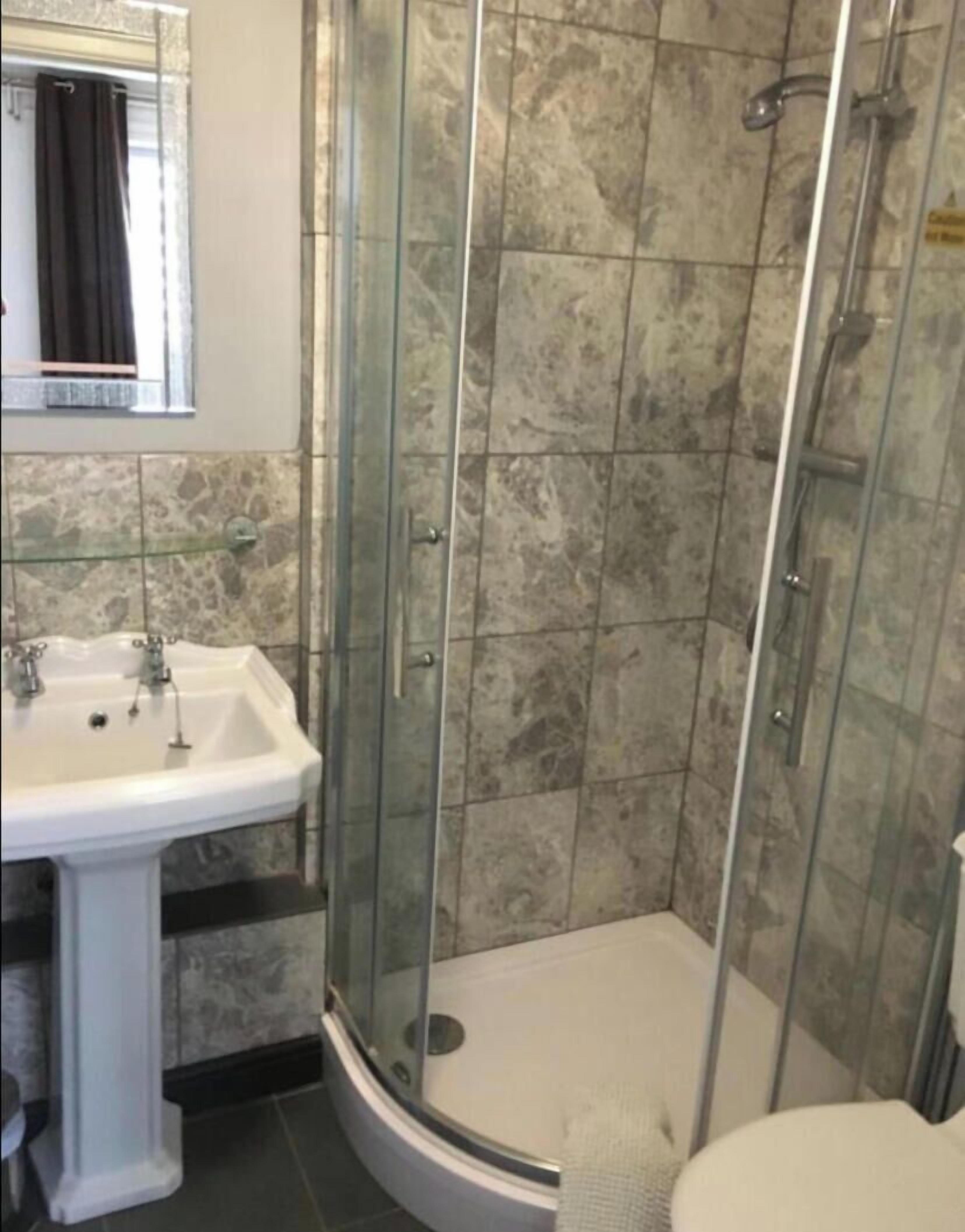 Shower, towels, toilet paper