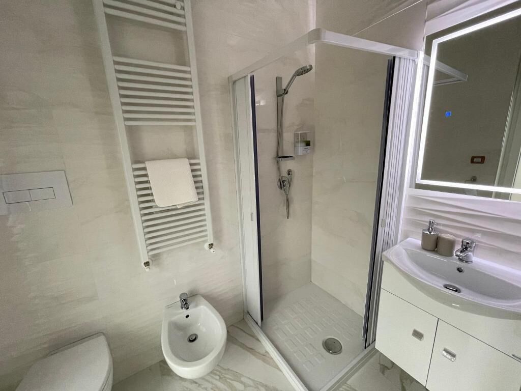 Shower, hair dryer, bathrobes, towels