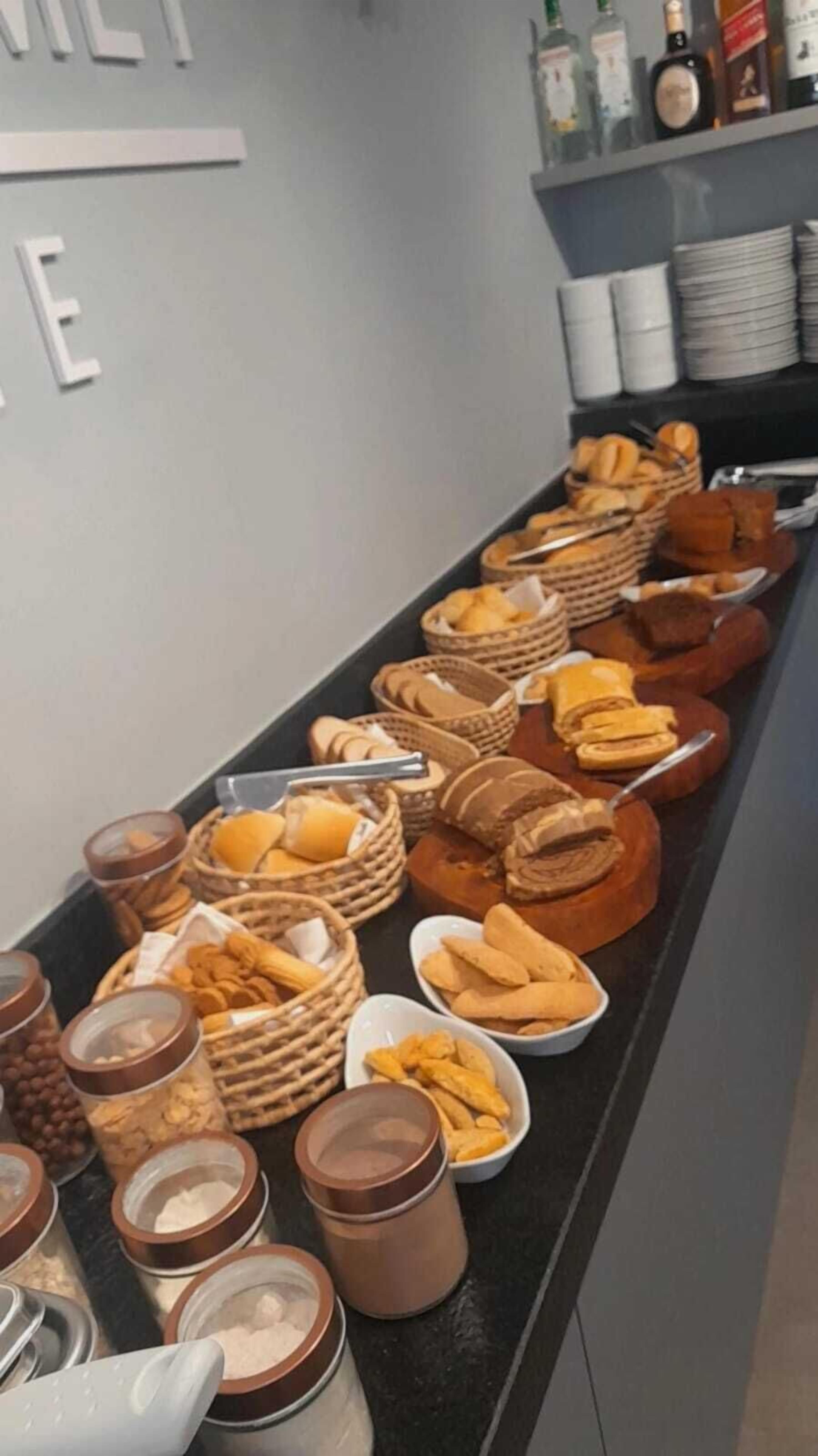 A buffet spread with various food items and condiments.